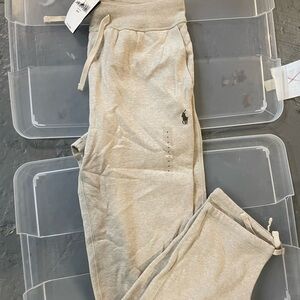 Men polo pants size small, with tags